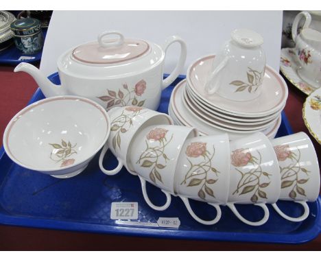 A Susie Cooper Porcelain Part Tea Service, decorated with pink roses, printed marks, comprising:- teapot and cover, sugar bow