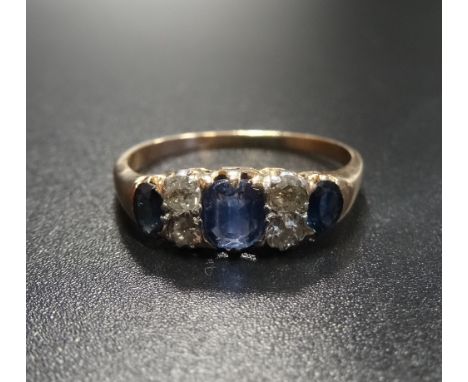 DIAMOND AND SAPPHIRE RINGthe three graduated sapphires separated by diamonds, on unmarked gold shank, ring size Q-R