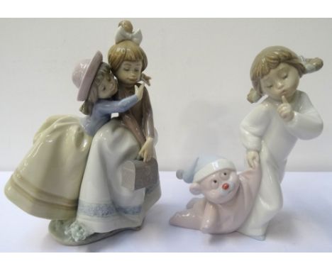 LLADRO FIGURE GROUPof two girls, 21cm high, and a Nao figure of a young girl with teddy bear, 19cm high, both with printed, i