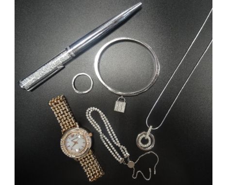 SELECTION OF SWAROVSKI CRYSTAL JEWELLERYcomprising a watch, a bracelet with padlock attachment, a pendant on chain, a slider 