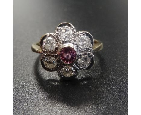 PINK SAPPHIRE AND DIAMOND CLUSTER DRESS RINGthe central pink sapphire approximately 0.25cts in six diamond surround totalling