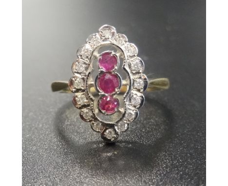 ART DECO STYLE RUBY AND DIAMOND PLAQUE RINGthe three central rubies in diamond surround, on eighteen carat gold shank, ring s