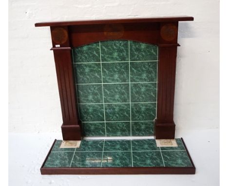 HAND MADE MAHOGANY FIRE SURROUNDwith a moulded shelf above an arched frieze carved with a Whooper swan and flanked by a pair 