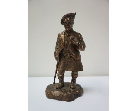 CAST BRONZED MODEL OF SIR HARRY LAUDERstanding on a naturalistic base in traditional dress, with his cane and pipe, indistinc