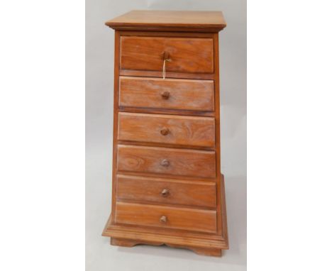 An Indonesian light figured hardwood tapered chest, of six drawers, 106cm high.