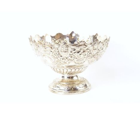 A late Victorian silver Monteith style bowl, with repoussé foliate and scroll border and with cartouche and flowerhead decora