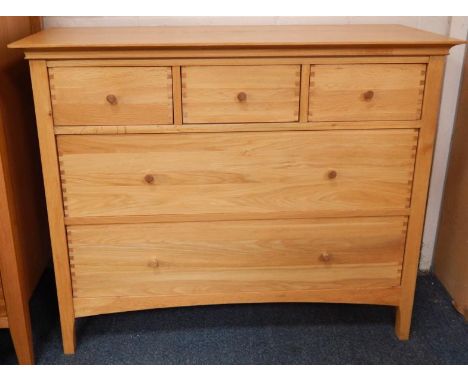 A modern light oak chest, of three short and three long drawers, 111cm wide.