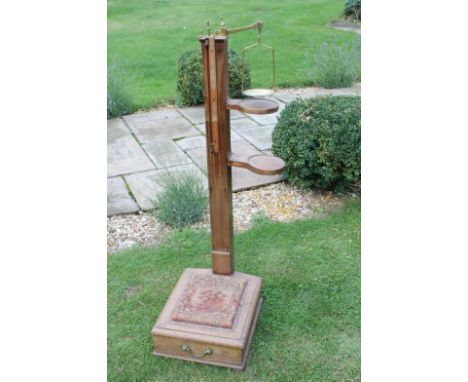 A late Victorian set of mahogany and brass platform weighing scales.