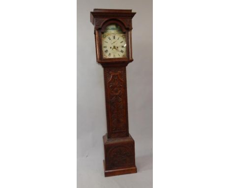 A carved oak longcase clock, with painted arch dial and swan automaton to the arch, with date aperture and signed S Hocking, 