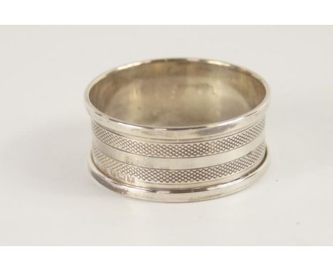 A silver napkin ring, with engine banding and plain cartouche, Birmingham 1945.