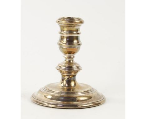A modern silver candlestick of Georgian design, with knopped stem, London 1960, 10.5cm high, and a silver bon bon dish with r