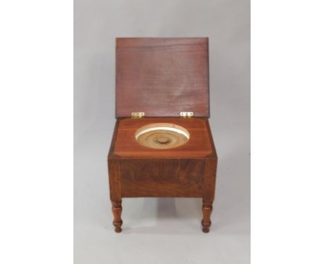 A Victorian mahogany stool commode, with original pot liner, on turned legs.
