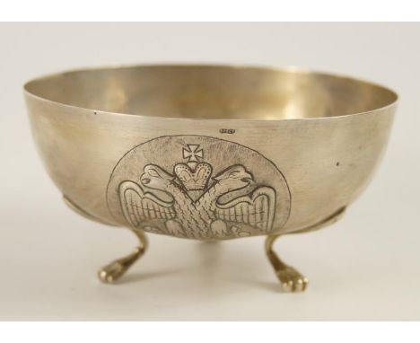 A Continental white metal bowl, embossed with two architectural landscape vignettes and a crest of two eagles with a crown, s
