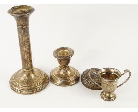 A George V silver candlestick, of plain design with beaded borders, Birmingham 1925, 18cm long, another dwarf silver candlest