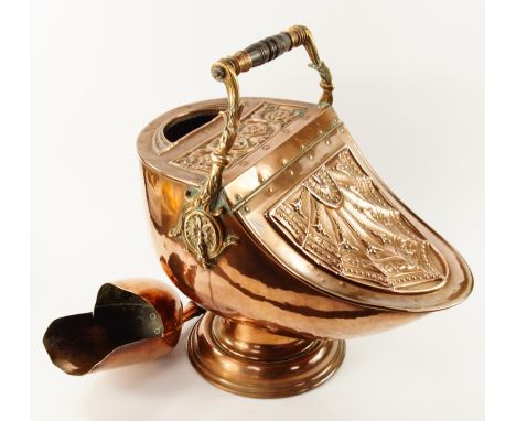 A Victorian copper coal scuttle, of helmet shaped design with hinged cover and embossed with harebells and beaded shell patte