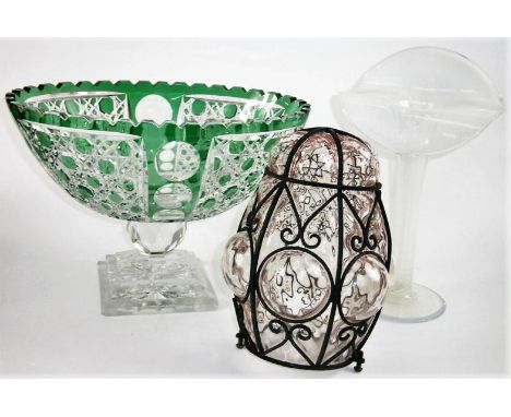 An oval green cased and cut glass tablecentre, an opaque glass specimen vase and an iron bound glass hanging pendant light sh