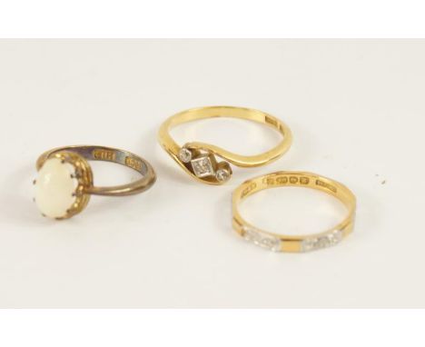 Three 18ct gold dress rings, one set with an opal.