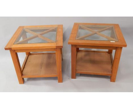 A pair of Indonesian light hardwood square lamp tables, with plate glass tops on square supports, with undershelf, 50cm x 50c