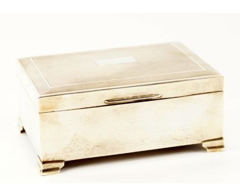 A silver cigarette box, with engine turned decoration, cedar lined, Birmingham 1961.