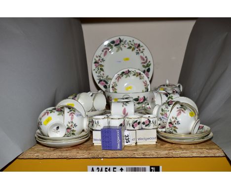 A WEDGWOOD HATHAWAY ROSE PATTERN DINNER SERVICE, comprising six tea cups, six saucers (two cracked), six coffee cups (one cra