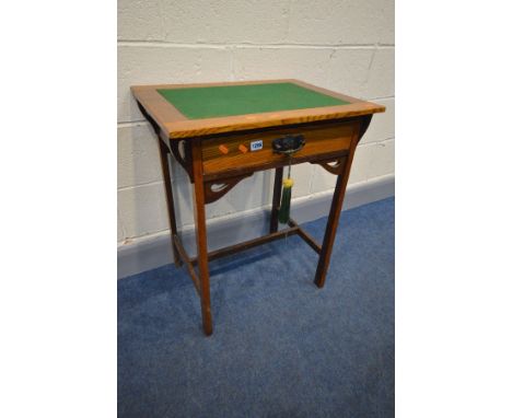 AN ARTS AND CRAFTS OAK WRITING/CARD TABLE, with a green baize inlay, single frieze drawer with art nouveau handles, width 61c