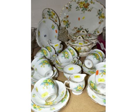 A BELL CHINA PRIMROSE PATTERN PART TEA SERVICE, comprising eleven tea cups, saucers, twelve tea plates, one twin handled cake