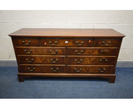 A REPRODUX MAHOGANY AND CROSSBANDED SIDEBOARD/CHEST OF NINE ASSORTED DRAWERS, with drop handles and bracket feet, width 153cm