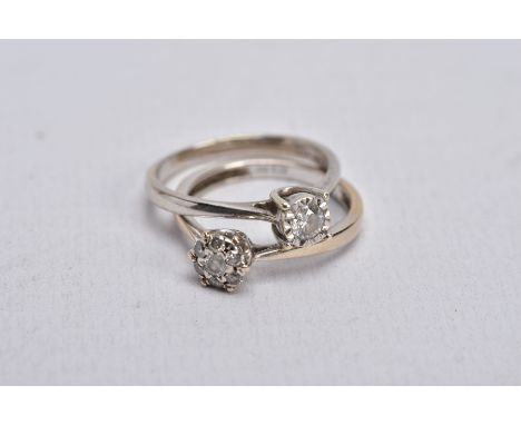 TWO DIAMOND RINGS, the first a white gold ring, designed with a raised illusion set, round brilliant cut diamond, stamped dia