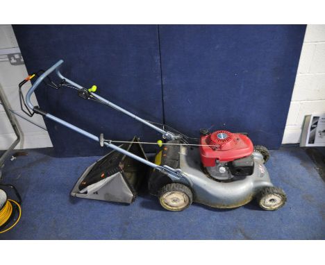 A HONDA i2Y PETROL SELF PROPELLED LAWN MOWER with grass box ( engine pulls freely but hasn't been started)