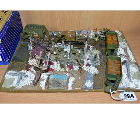 A DIORAMA OF A WWI FIELD HOSPITAL, approximately 1/76 scale, of wooden and plastic construction on a plastic and polystyrene 