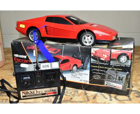 A BOXED NIKKO RADIO CONTROL FERRARI TESTAROSSA, model No 10030, 1/10th scale, pop up headlights, with remote control, length 