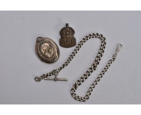 A VICTORIAN SILVER LOCKET, A SILVER ALBERT CHAIN AND AN A.R.P. BADGE, the a.f. Locket of an oval form, with a decorative two 