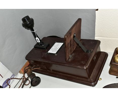 AN EARLY GPO PRE DIAL MAGNETO WALL PHONE, wooden with hinged shelf, handle to right side, ear piece to the left side with cab