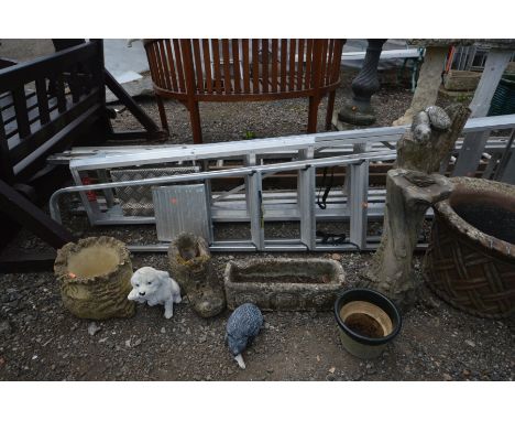A COMPOSITE TREE TRUNK STYLE GARDEN STAND, along with three various planters or various shapes, a plant pot and two garden it