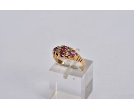 A VICTORIAN DIAMOND AND RUBY BOAT RING, set with four circular cut rubies, interspaced with four rose cut diamonds, openwork 