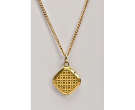 A YELLOW METAL CURB LINK CHAIN AND A YELLOW METAL LOCKET, the curb link chain fitted with a spring clasp stamped '375', lengt