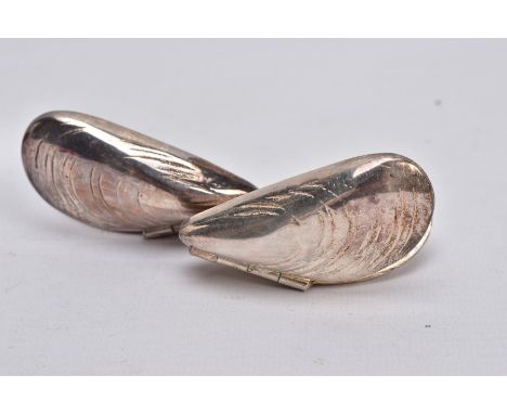 A PAIR OF WHITE METAL MUSSEL EATERS, each in the form of hinged mussel shells, no stamps or marks, length 63mm, in a culinary