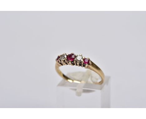 A 9CT GOLD RUBY AND DIAMOND RING, designed with three graduated circular cut rubies, interspaced with two round brilliant cut