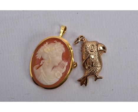 A 9CT GOLD PENDANT AND A YELLOW METAL CAMEO BROOCH/PENDANT, the first a hollow pendant in the form of a realistically texture