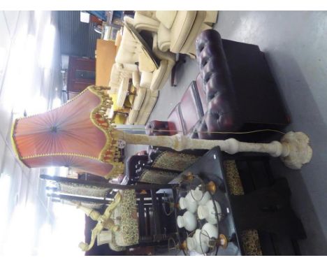 AN ALABASTER ELECTRIC STANDARD LAMP AND SHADE 