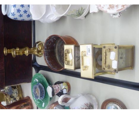 A QUARTZ CARRIAGE CLOCK, A COPPER, OVAL TWO HANDLED PLANTER, A PAIR OF ANTIQUE BRASS CANDLESTICKS, ON CIRCULAR BASES, WITH EJ