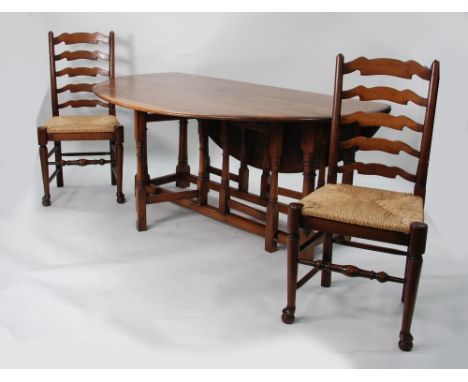 MULTI YORK, MODERN REPRODUCTION OAK DROP LEAF DINING TABLE, with oval top and turned legs and a  SET OF SIX OAK LADDER BACK S