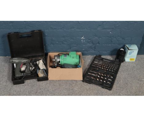 A collection of tools - comprising of a cased 'Rapesco' electric stapler with extra staples, a cased set of drill bits &amp; 