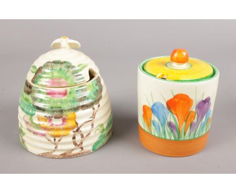Two pieces of Clarice Cliff. Includes Aurea beehive honey pot, along with a Royal Staffordshire Crocus preserve pot.  Lid rep