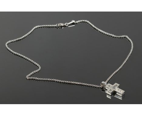 A Chopard 18ct white gold 'Happy Diamonds' cross pendant on chain. With three round brilliant cut diamonds enclosed within th