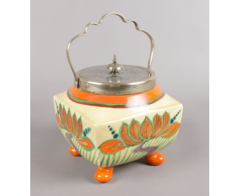 A Clarice Cliff Newport pottery Fantasque biscuit barrel.  Cracked. Crazed to the bottom of the barrel.