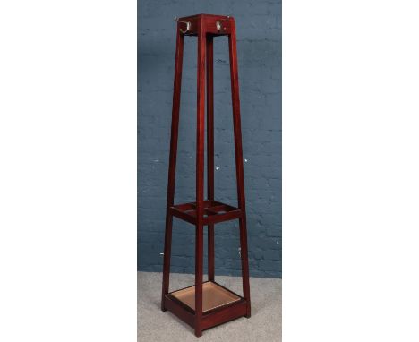 A Mahogany coat/stick stand. (178cm height, 39cm width 39cm depth)  