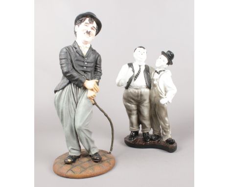 Two ceramic figures. Charlie Chaplin (38cm height) &amp; Laurel &amp; Hardy (29cm height).  