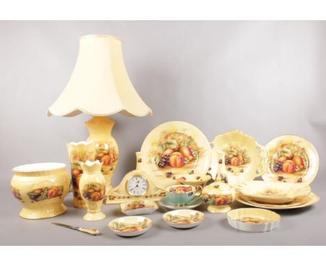 A collection of Aynsley 'Orchard Gold'. Vases, bud vases,  planter, trinket box, pin dishes, mantle clock, cup/saucer. To inc