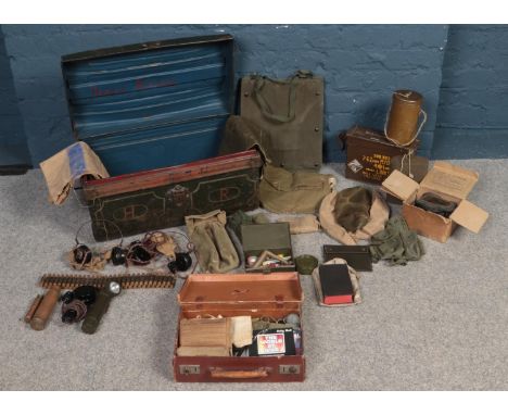 Militaria -A twin handle tin trunk with contents of WW2 military equipment. To include gas mask, radio headphones &amp; micro